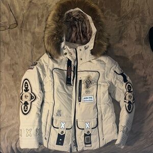 Bogner white ski jacket. Size 8 with hood and real fin raccoon fur.